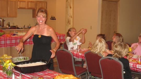 Dinner is served at a family reunion in the Grand Vermilion Chalet