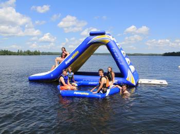 Guests enjoy the inflatable water slide