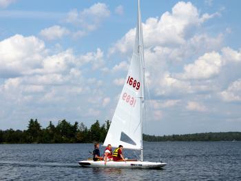 Boys go for a sail on one of Pehrson Lodge's MC-Scows.