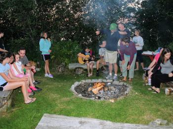 Families join together at the weekly resort s'mores night