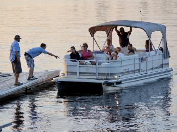 A family returns from a pontoon cruise on Lake Vermilion