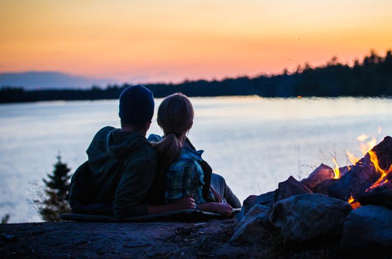 Couple watches the sunset on Lake Vermilion