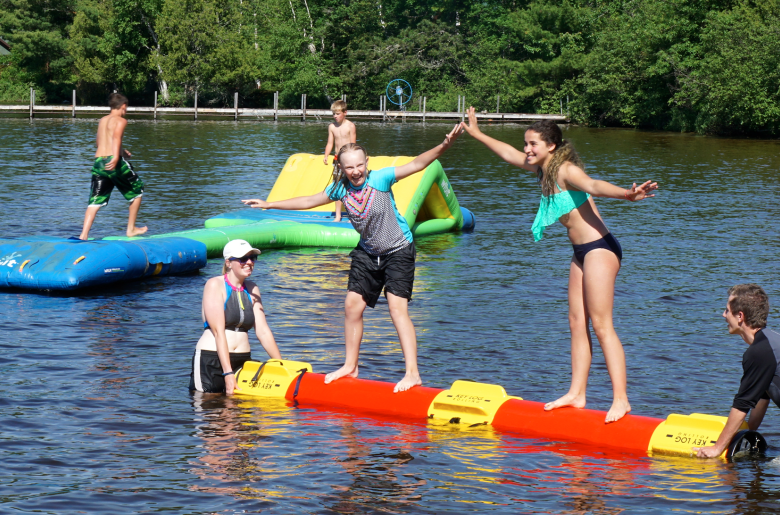 Children play at the beach at Pehrson Lodge