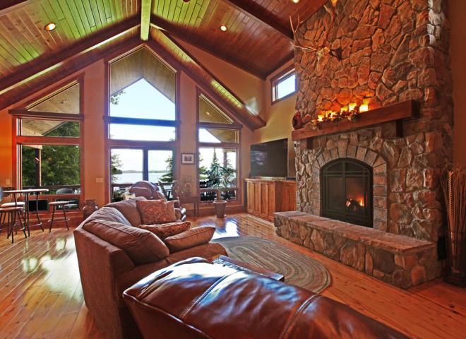 Living room with spacious seating, gas fireplace, and access to the deck.