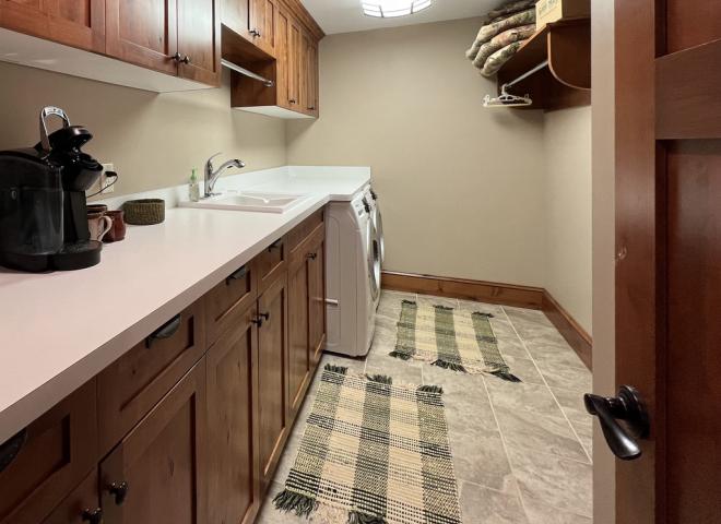 Laundry room with utility sink.