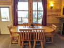 Dining room with a table for six and views of Lake Vermilion.