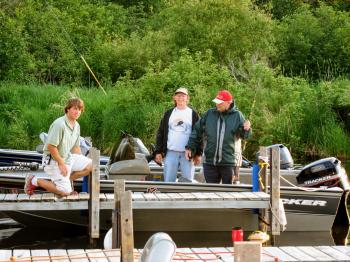 A member of Pehrson Lodge dock staff helps guests in the harbor
