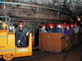Soudan Underground mine tour with tourists on the train portion.