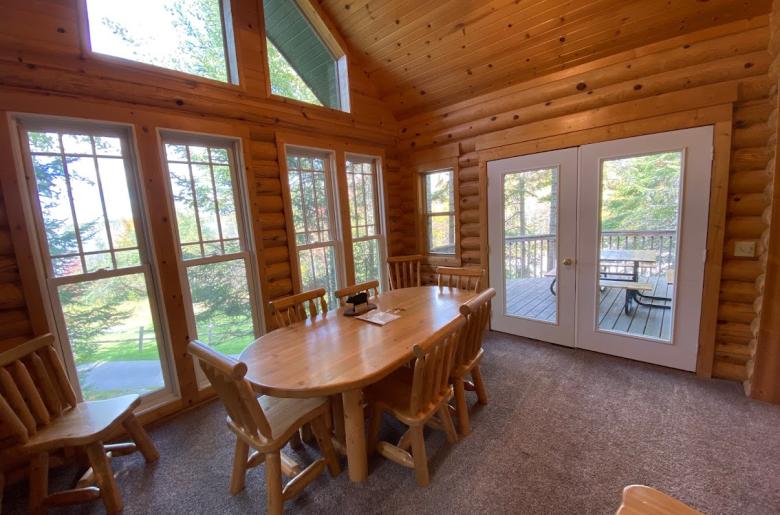 Dining area with access to the deck area and views of the lake.