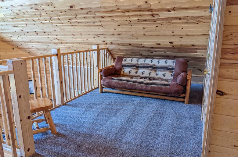 Loft area with a futon.