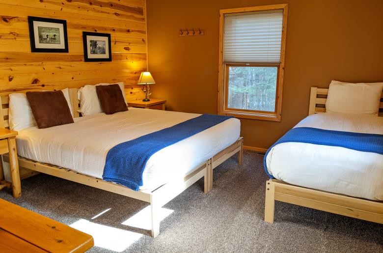 Master bedroom with a king, twin, and ensuite bathroom.