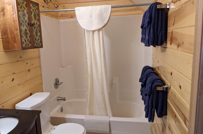 Upstairs bathroom with a standard tub/shower.
