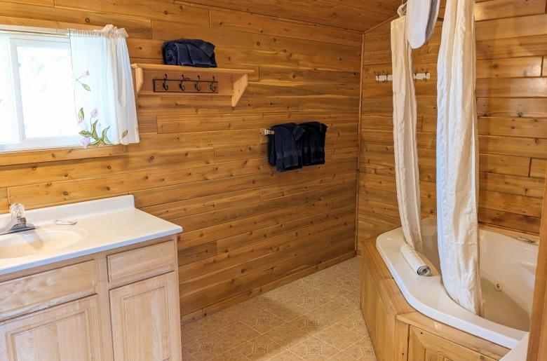 Loft bathroom with an oversized whirlpool tub/shower.