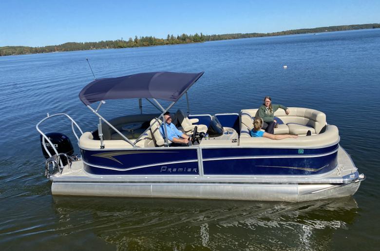 Friends heading out on a 150HP Triple-toon.