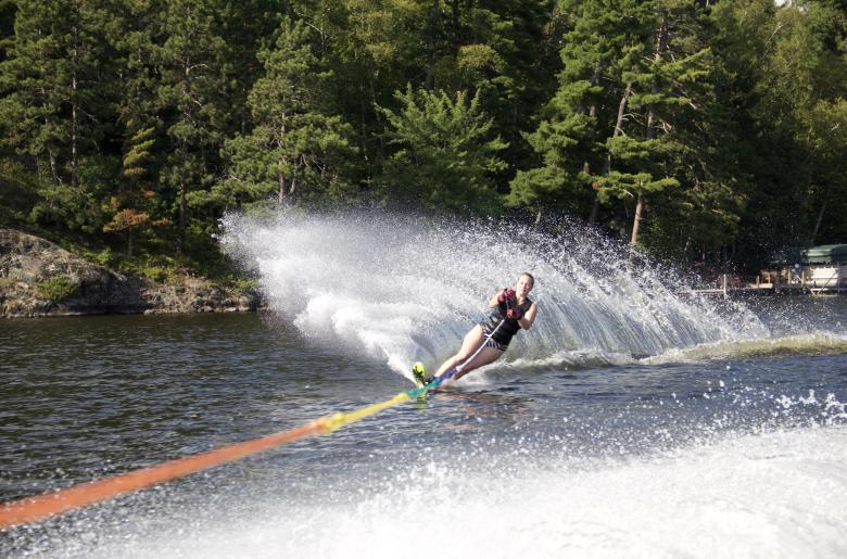 Experienced water skier being towed