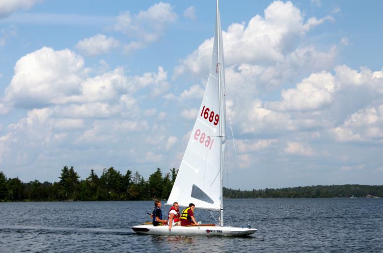Boys go for a sail on one of Pehrson Lodge's MC-Scows.
