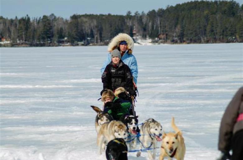 Family dogsleds on Lake Vermilion during winter