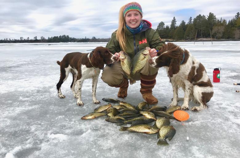 Woman ice fishes during Lake Vermilion winter