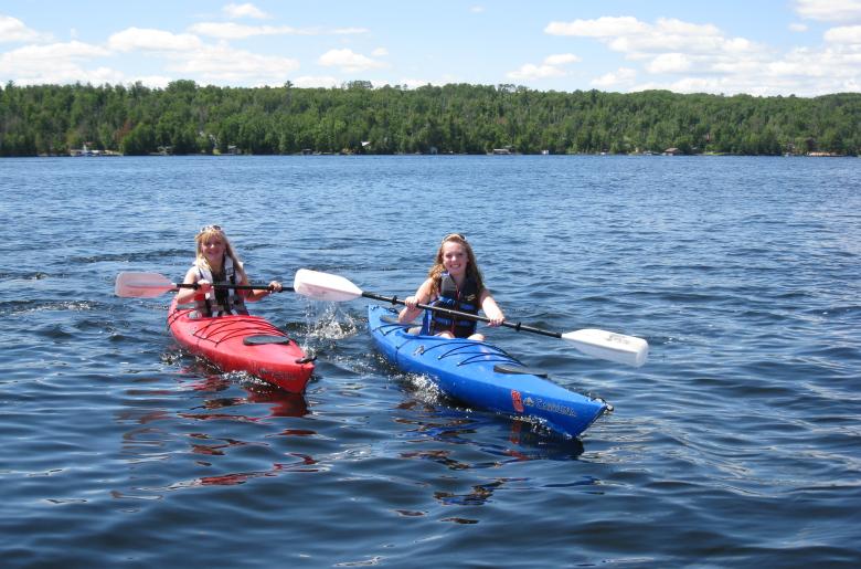 Two teens kayaking on Lake Vermilion