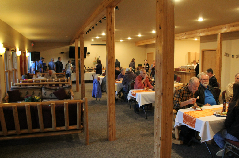 Guests enjoy a meal in the basement of the Grand Vermilion Chalet