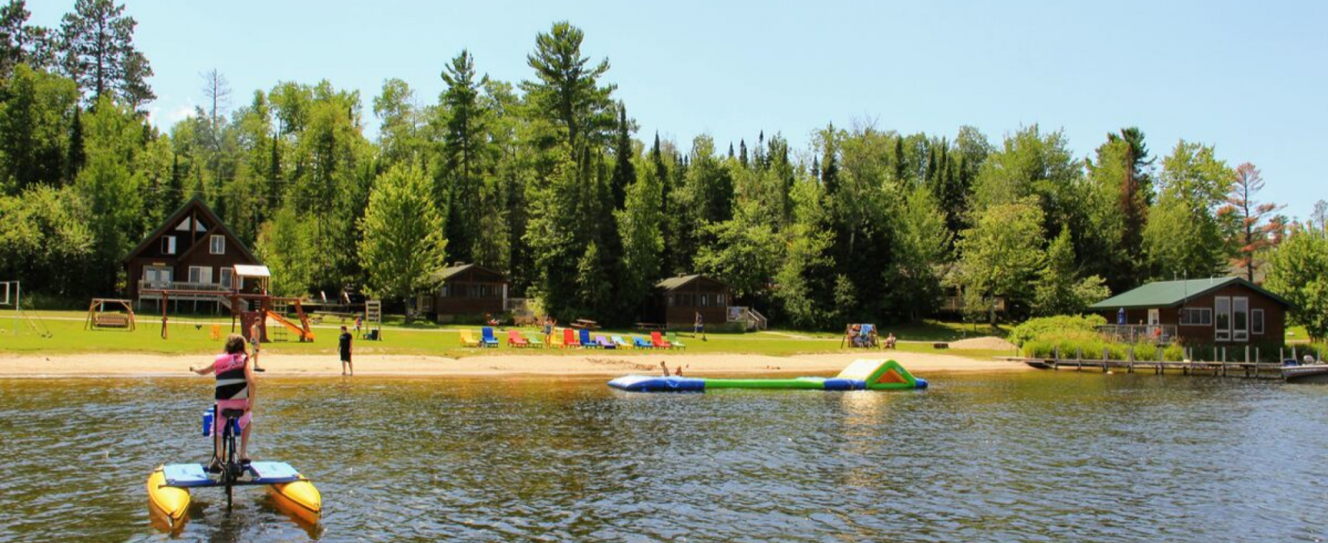 Children playing on the beach at Pehrson Lodge