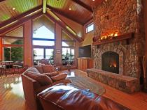 Living room with spacious seating, gas fireplace, and access to the deck.